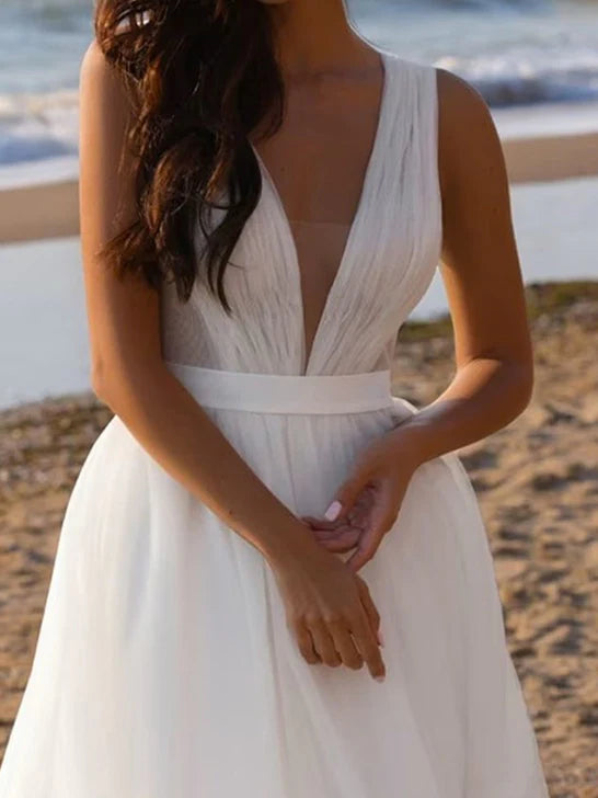 Bohemian Plunging V-Neck Crinkle Tulle Sleeveless A-Line Beach Wedding Dress with Sweep Train