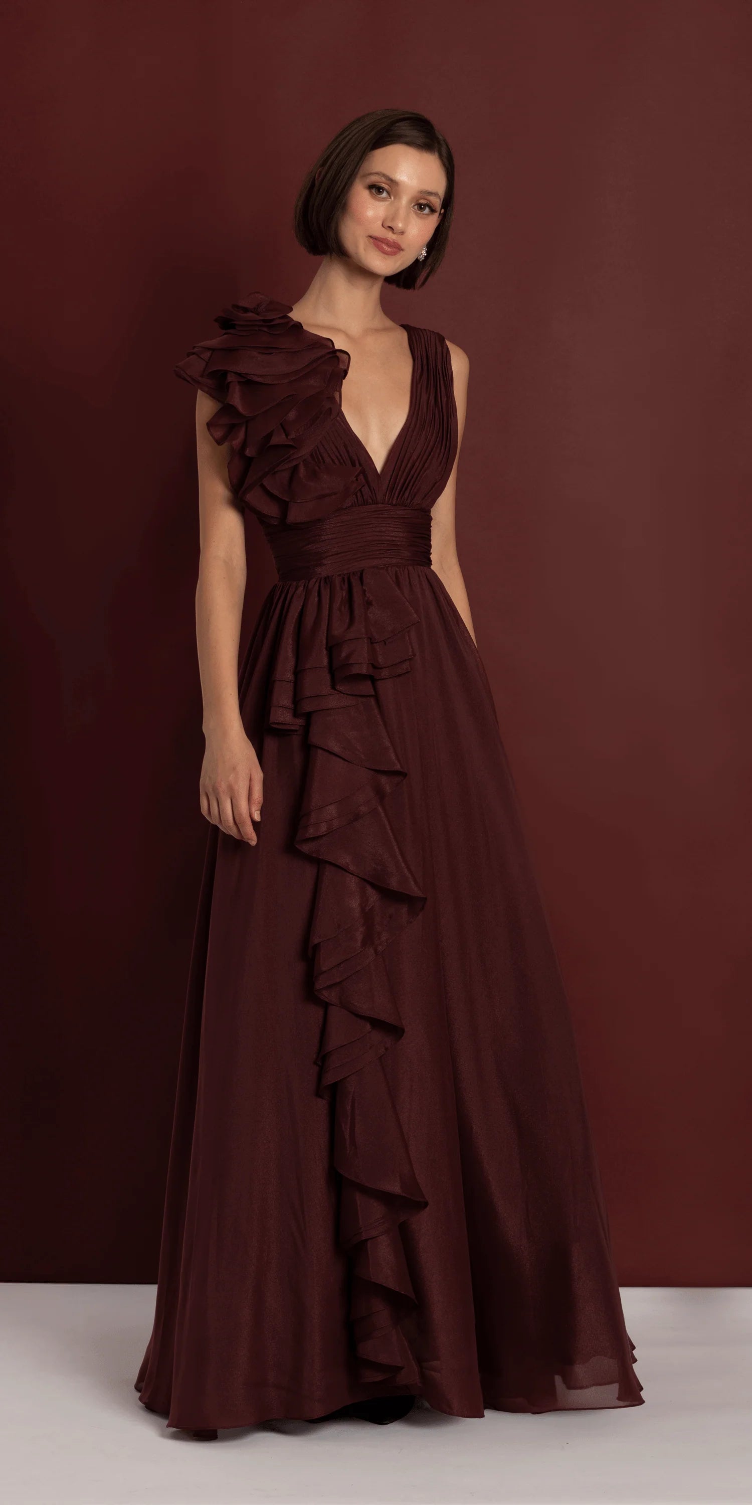 Burgundy chiffon evening dress with ruffled shoulder, deep V-neck, and floor-length A-line skirt