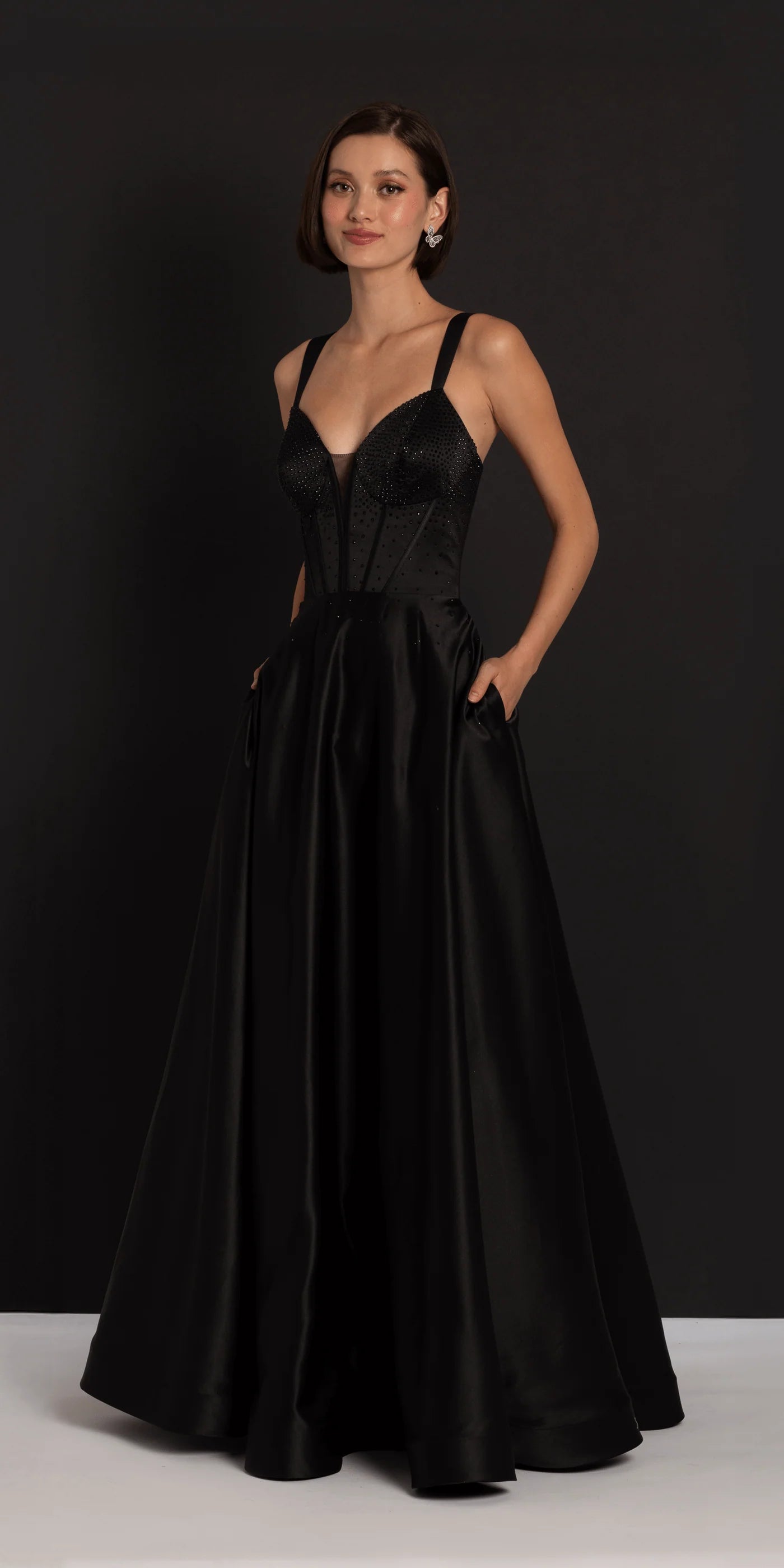 Glamorous beaded corset evening gown with satin ball gown skirt, lace-up back and pockets
