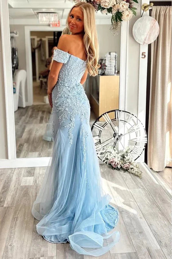 Full length view of a model posing in the elegant off-shoulder lace mermaid prom dress.