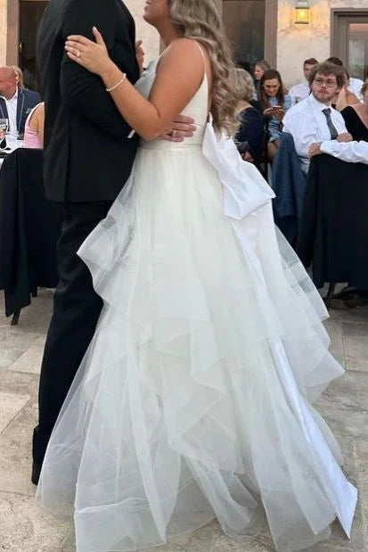 Spaghetti Strap Tulle Wedding Dresses with Deep V-Neck, Oversized Back Bow and Ruffled Tiered Skirt Bridal Gown