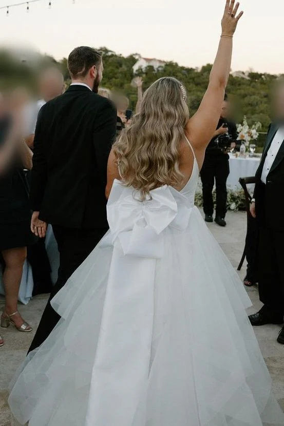 Spaghetti Strap Tulle Wedding Dresses with Deep V-Neck, Oversized Back Bow and Ruffled Tiered Skirt Bridal Gown