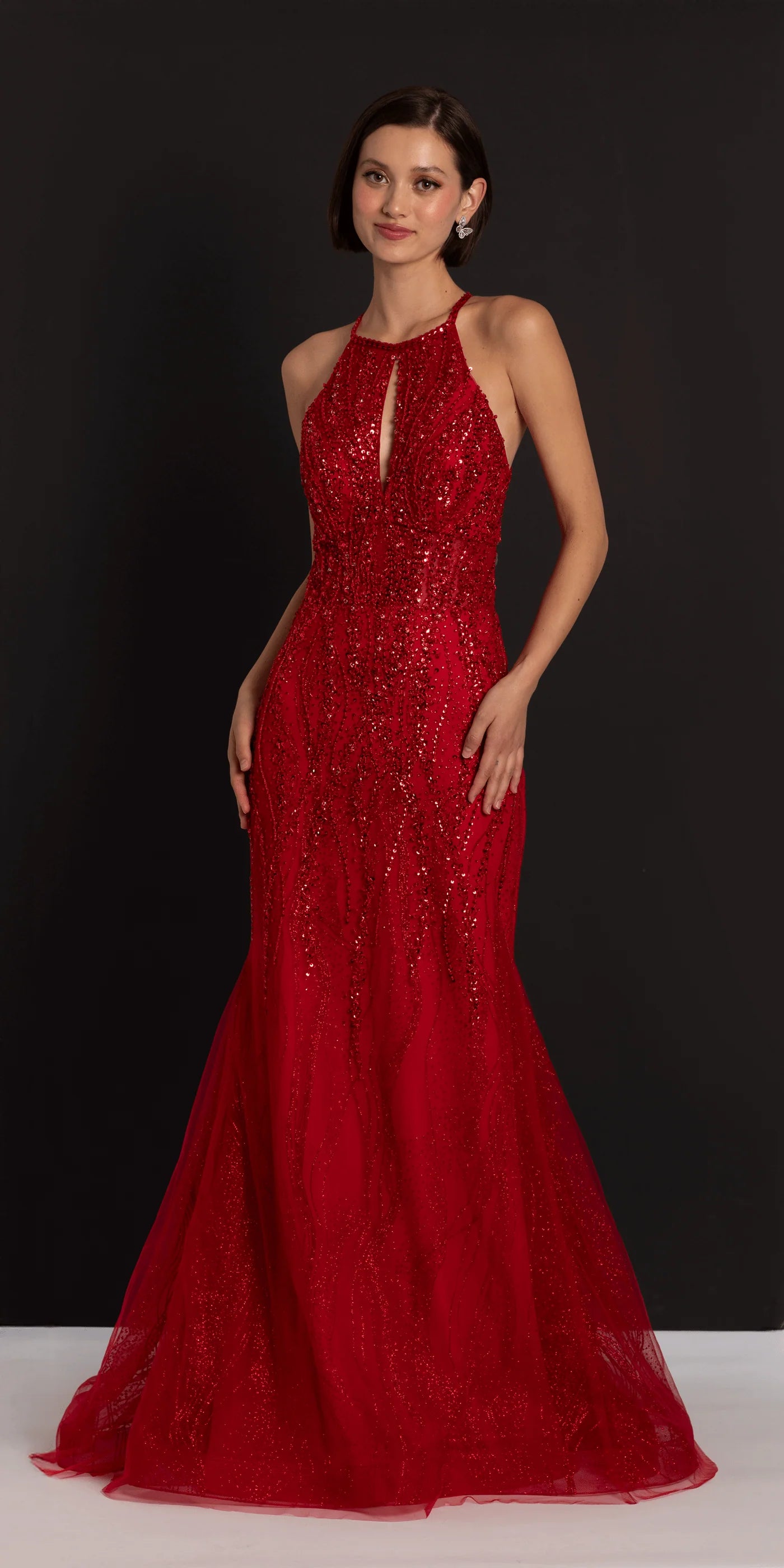 Striking halter neck beaded evening gown with keyhole detail, mermaid skirt and train